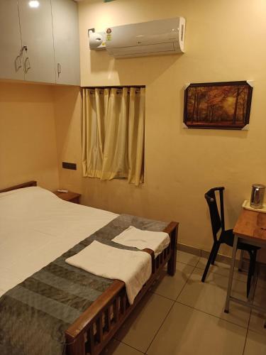 Sree Nivas Homestayにあるベッド