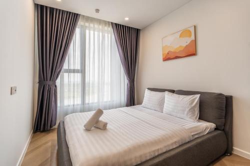 Ένα ή περισσότερα κρεβάτια σε δωμάτιο στο SMILE HOME - LUMIERE RIVERSIDE LUXURY INFINITY POOl