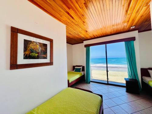 Postel nebo postele na pokoji v ubytování Hotel Sierra Negra