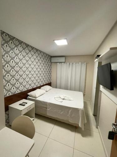Aldeia das Flores Hotelにあるベッド