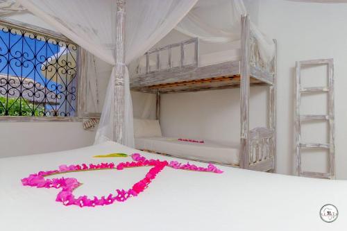 מיטה או מיטות בחדר ב-Kenya Residence Watamu