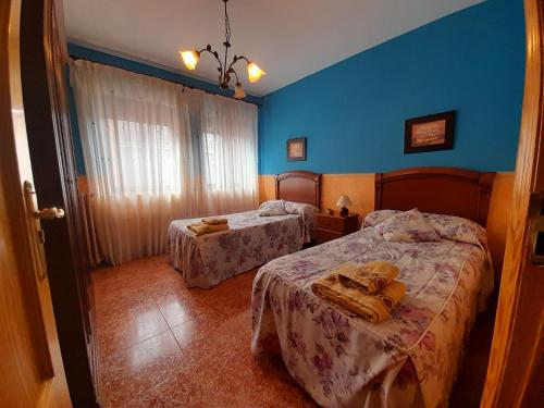 Postel nebo postele na pokoji v ubytování Casa Rural Las Barricas