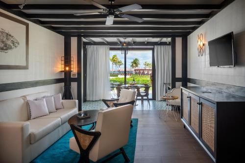 a living room with a couch and a table at Ocean Riviera Paradise All Inclusive in Playa del Carmen