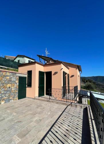 a house with a large patio in front of it at Villa Nina in Moneglia