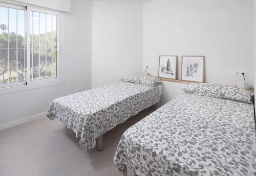 Un pat sau paturi într-o cameră la El Retiro, 365-Rentals
