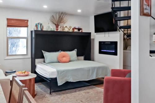 a bedroom with a bed with a black headboard at Cozy Hideaway Retreat Unit 4 near Durango in Durango