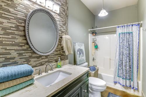 a bathroom with a sink and a mirror at Inviting Wasilla Vacation Rental 6 Mi to Big Lake in Wasilla