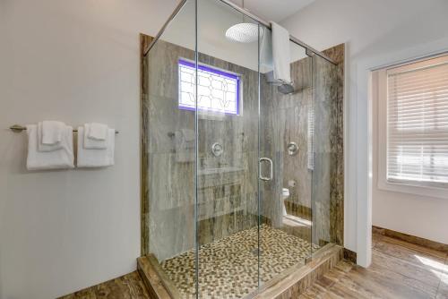 a bathroom with a shower with a glass door at Villa Coastal by Brightwild-Pool & Free Parking in Key West