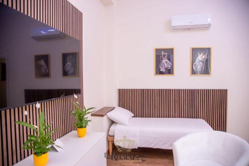 a hospital room with a bed and a mirror at La Regina Luxury Holiday Home in Cava deʼ Tirreni