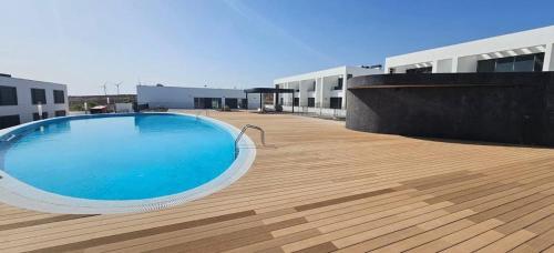 a large swimming pool on the roof of a building at Apartamento Abades Playa & Relax in Abades