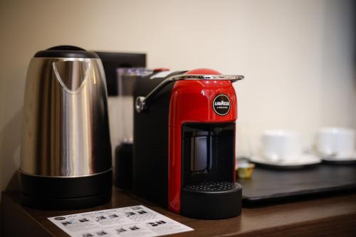 a red coffee maker sitting on top of a counter at CLOUD 5 Blloku Rooms Tirana in Tirana