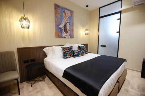 a bedroom with a large bed in a room at CLOUD 5 Blloku Rooms Tirana in Tirana