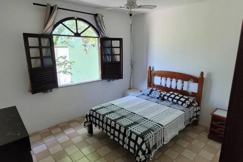 Tempat tidur dalam kamar di Nana's House Vilas