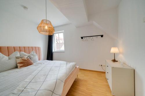 Ένα ή περισσότερα κρεβάτια σε δωμάτιο στο Altstadt Apartment 2 Zimmer am Weibermarkt