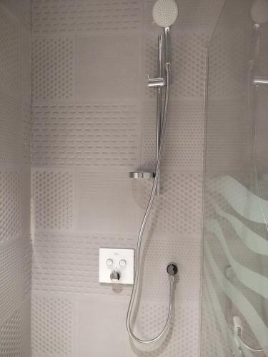 a shower with a glass door in a bathroom at وحدات فندقية خاصة-crown suite in Al Jubail