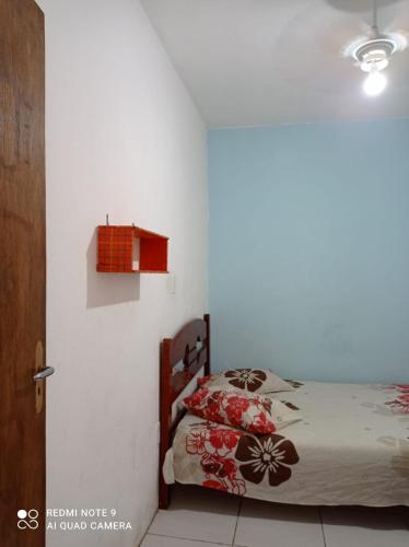 a bedroom with a bed in a room at Casa com piscina in Rio Grande
