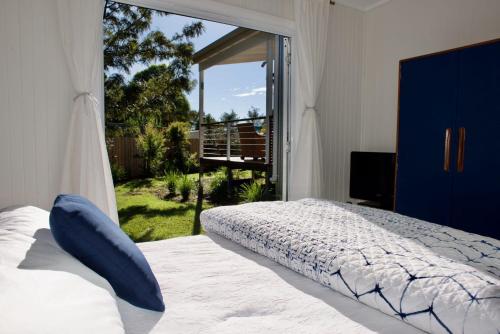 Postel nebo postele na pokoji v ubytování Alora Cottage