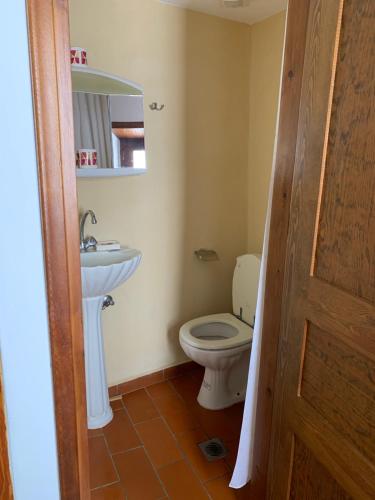 a bathroom with a toilet and a sink at Σπιτι Χωρα Πατμου in Patmos
