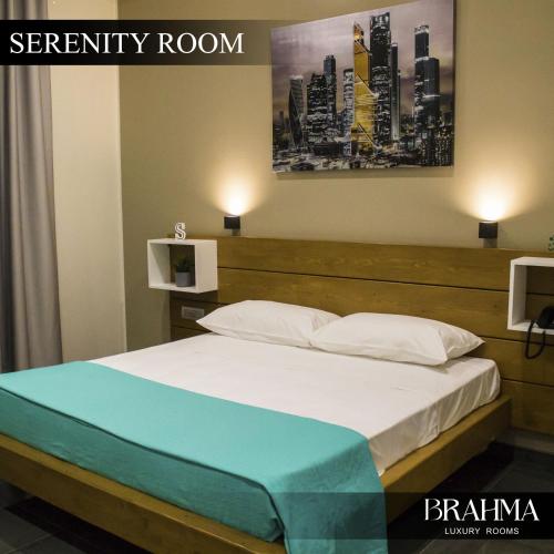 Ein Bett oder Betten in einem Zimmer der Unterkunft Brahma Luxury Rooms