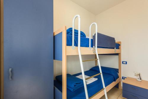 Ένα ή περισσότερα κρεβάτια σε δωμάτιο στο Le primule