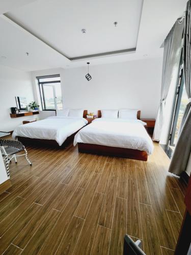 Postel nebo postele na pokoji v ubytování Happy Bun Hotel Da Lat