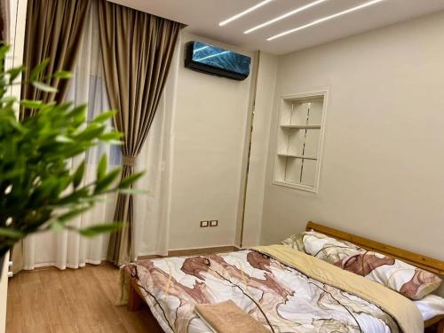 Postel nebo postele na pokoji v ubytování Urban Elegance @ Maadino6