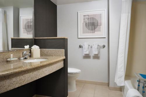 a bathroom with a sink and a toilet at Courtyard by Marriott Washington Capitol Hill/Navy Yard in Washington