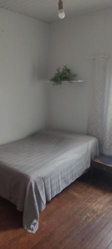 Кровать или кровати в номере Hostel Namastê