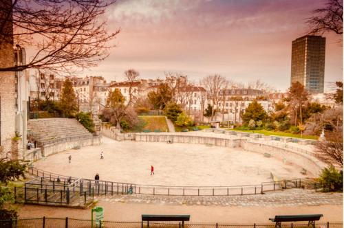 a large amphitheater in the middle of a city at Appartement Quartier Latin in Paris
