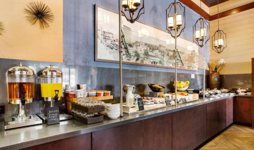 a restaurant with a counter with food on it at The Emily Morgan Hotel - A DoubleTree by Hilton in San Antonio