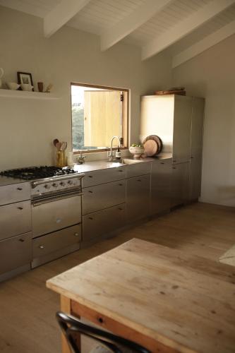a kitchen with stainless steel appliances and a window at Casa Avalon in Myocum