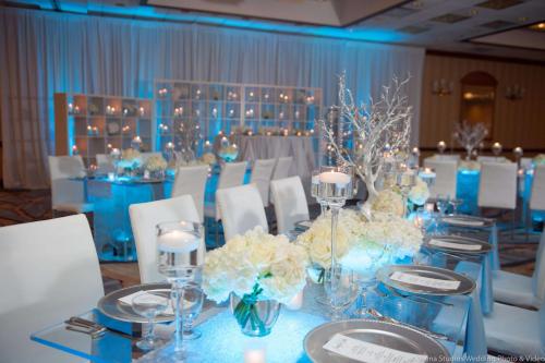 a room with a table with white chairs and flowers at DoubleTree by Hilton Chicago/Alsip in Alsip