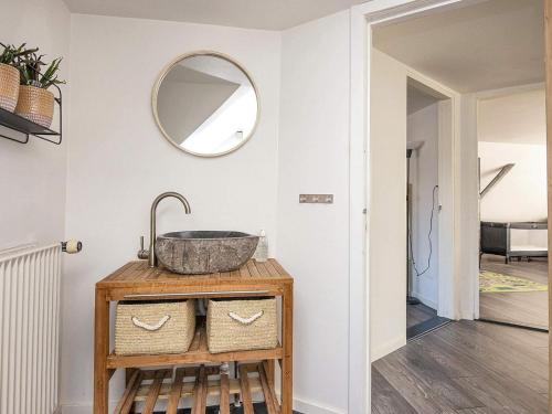 a bathroom with a sink and a mirror on a wall at 5 star holiday home in Grindsted-By Traum in Grindsted