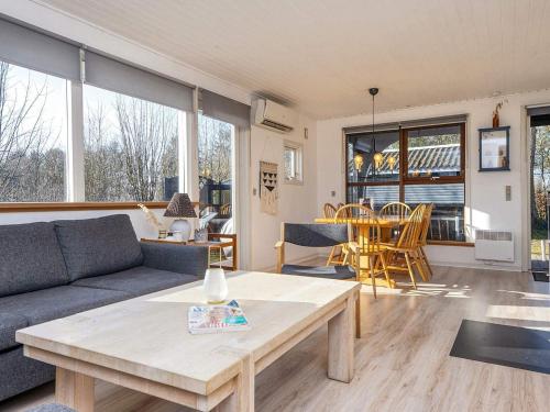 a living room with a couch and a table at 5 person holiday home in Ansager-By Traum in Ansager
