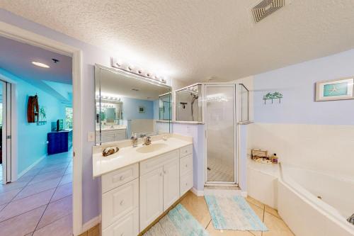 a bathroom with a sink and a shower at Oceanwalk 10-203 in New Smyrna Beach