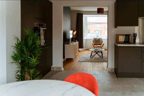 a room with a kitchen and a living room at Home from Home in Tyne and Wear in Westoe
