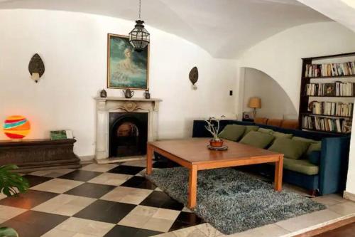 a living room with a couch and a fireplace at Casa Benedetta in Martínez