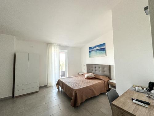 Postel nebo postele na pokoji v ubytování Valle degli Ulivi B&B