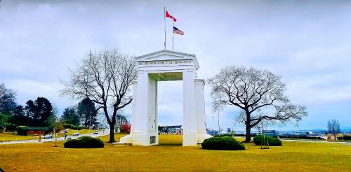 a white monument with an american flag on top of it at Scorpion Hiuse Langley -ROOM 1 Separate restroom in Pitt Meadows