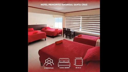 a red room with two beds and a table at PRINCIPITO SANTA CRUZ in Santa Cruz de la Sierra