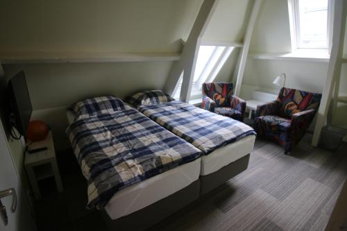 En eller flere senge i et værelse på Pension Sissi