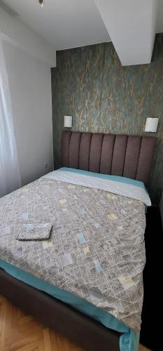 Ένα ή περισσότερα κρεβάτια σε δωμάτιο στο Ristevski Apartments