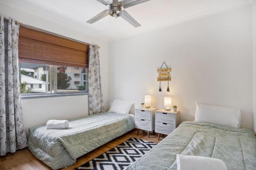 Postel nebo postele na pokoji v ubytování Cotton Tree Tranquil Gem Central Apartment