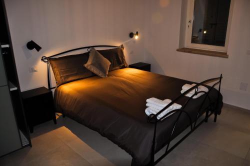 a bedroom with a bed in a room at Bramante Suites Urbino in Urbino