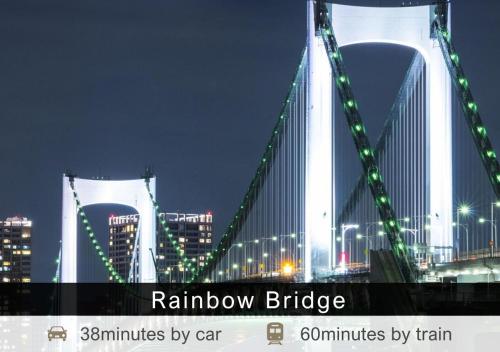a view of a bridge at night with buildings at Tokyu Stay Ikebukuro in Tokyo