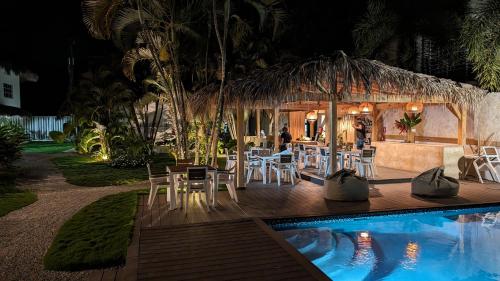 a resort with a swimming pool at night at Empyrean Tropical Wellness Portillo in Las Terrenas