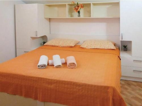a bedroom with two beds with towels on it at Seaside apartments with a swimming pool Sobra, Mljet - 22926 in Babino Polje