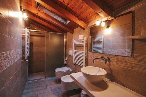 a bathroom with a sink and a toilet and a shower at Agritur il Torchio in Arco