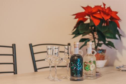 two bottles of wine and glasses on a table at Agritur il Torchio in Arco