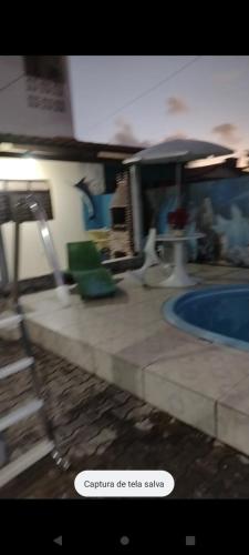 a picture of a swimming pool in a house at Kátia Lucia in Lucena